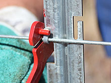 You will be provided with a purpose made tool to bend the dropper tags over the fence wire. 